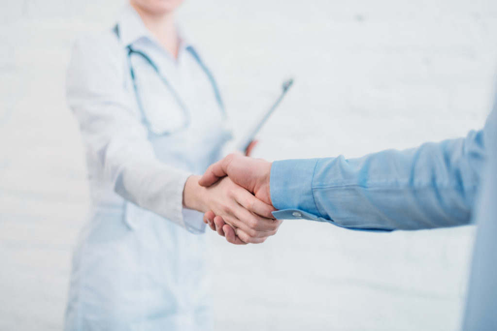 Physician handshake image representing physician relationships