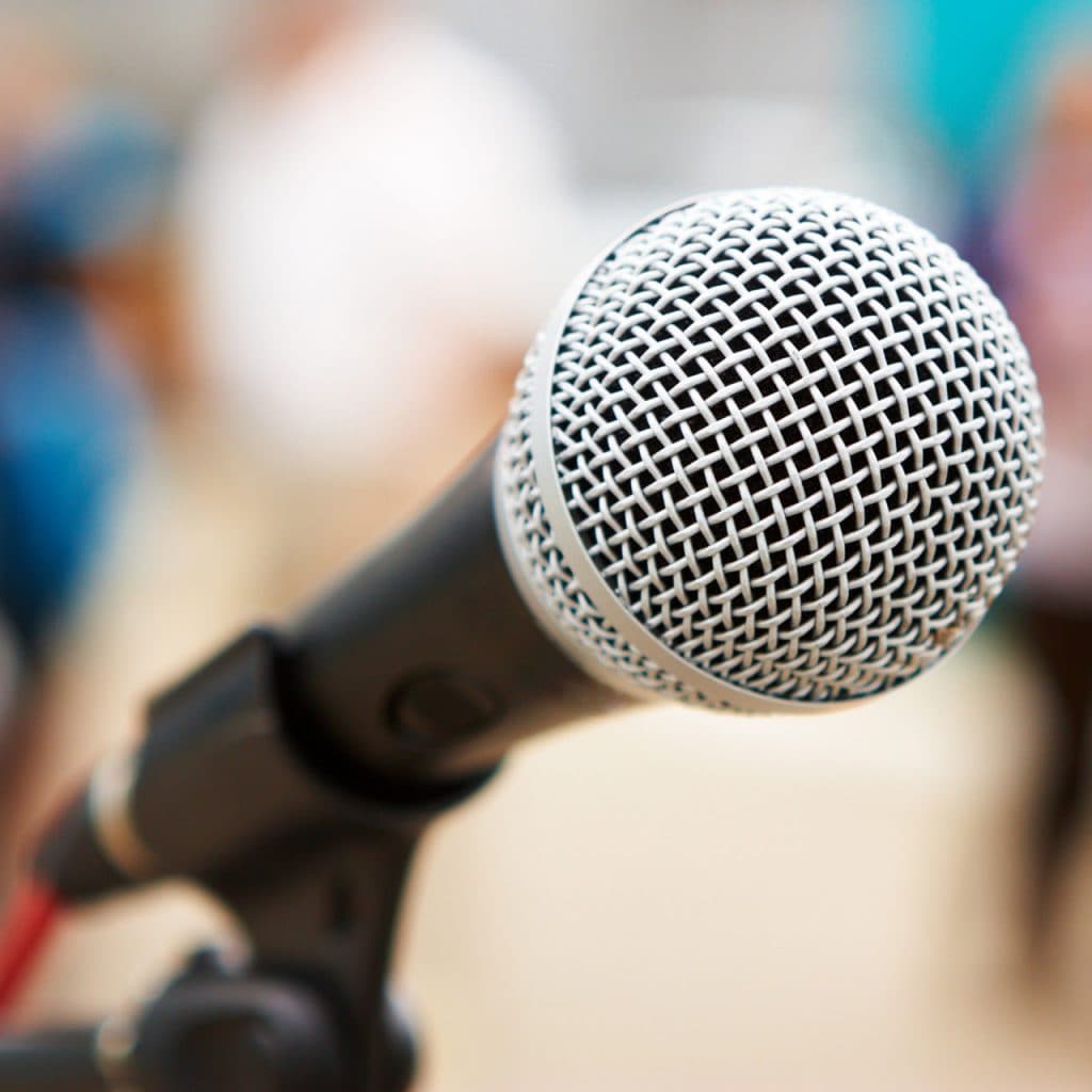 Close-up of a microphone against a blurry bokeh background