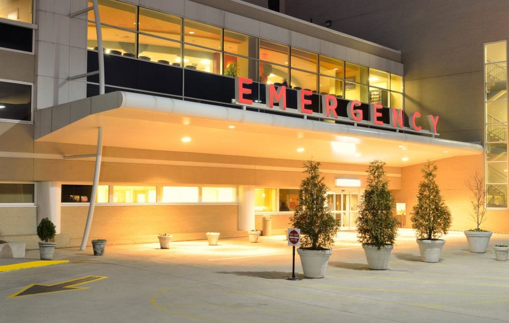Emergency Room entrance at a hospital at night.