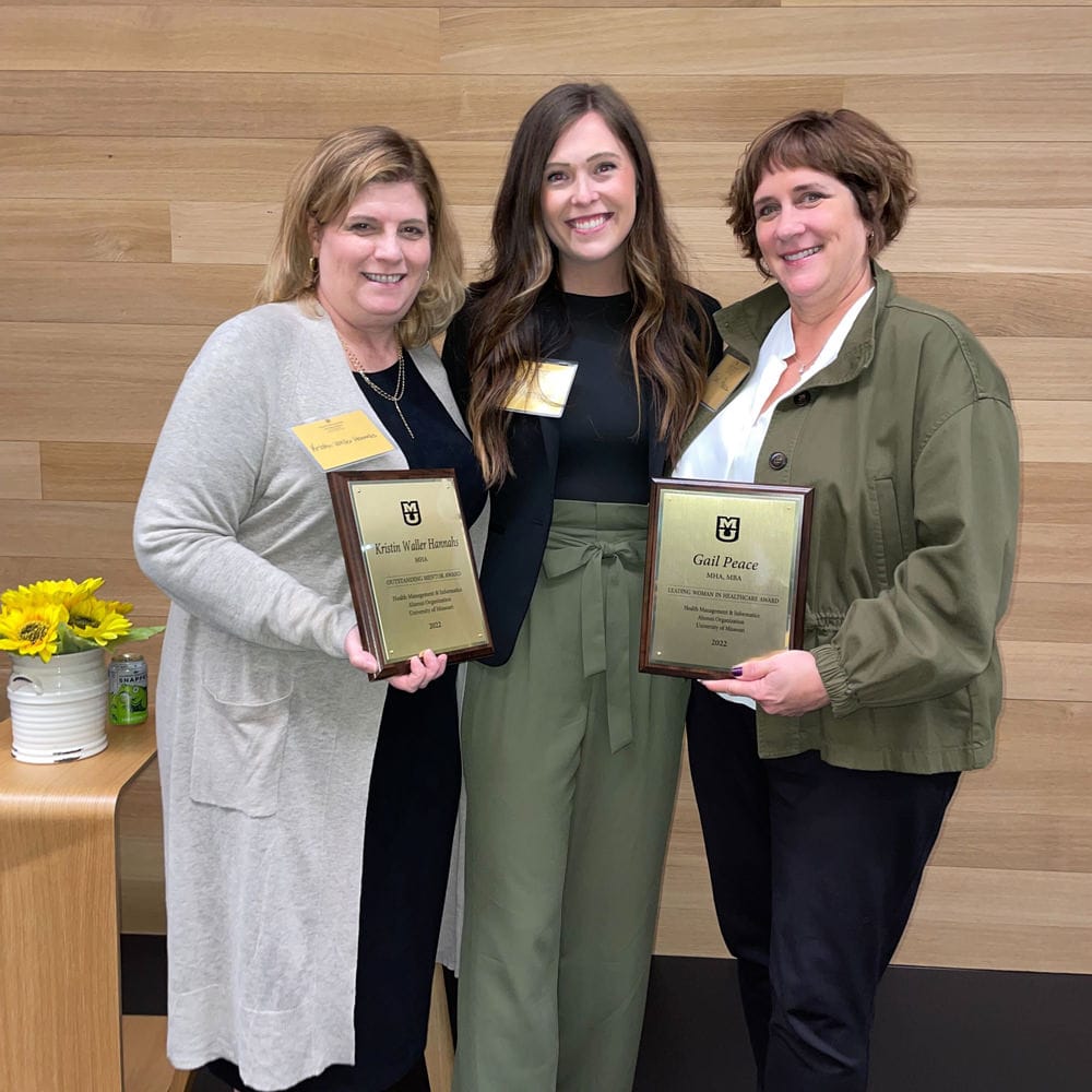 Gail Peace (Founder and CEO) and Kristin Waller (VP of Client Success) of Ludi being presented with the Leading Woman in Health Woman in Healthcare and Outstanding Mentor Award, respectively, by the Department of Health Management and Informatics at the University of Missouri School of Medicine