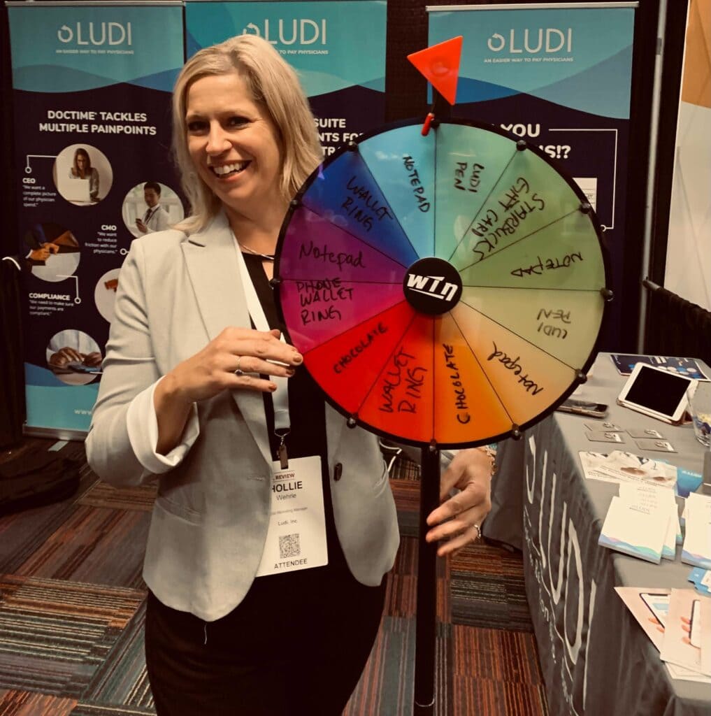 Hollie working the booth at the Becker's conference, with our "spin the wheel" raffle!