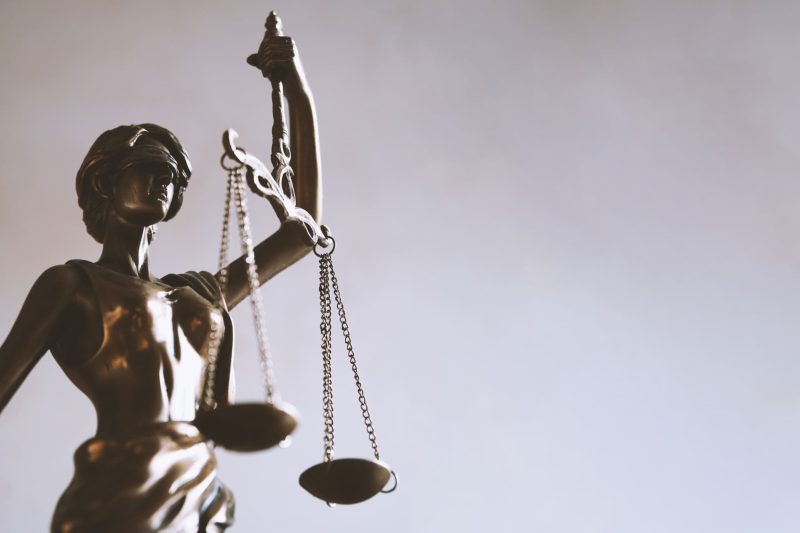Lady justice image holding balance symbolizing law
